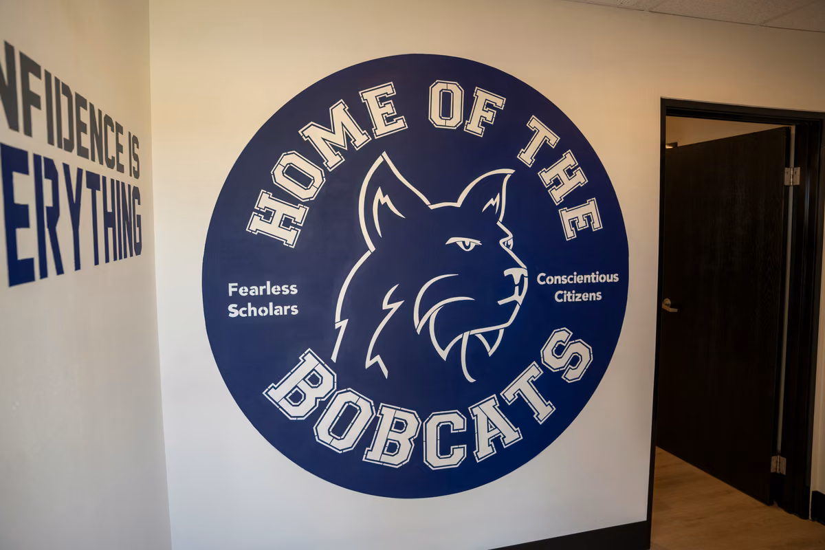 A large Home of the Bobcats wall graphic in the Dojo.