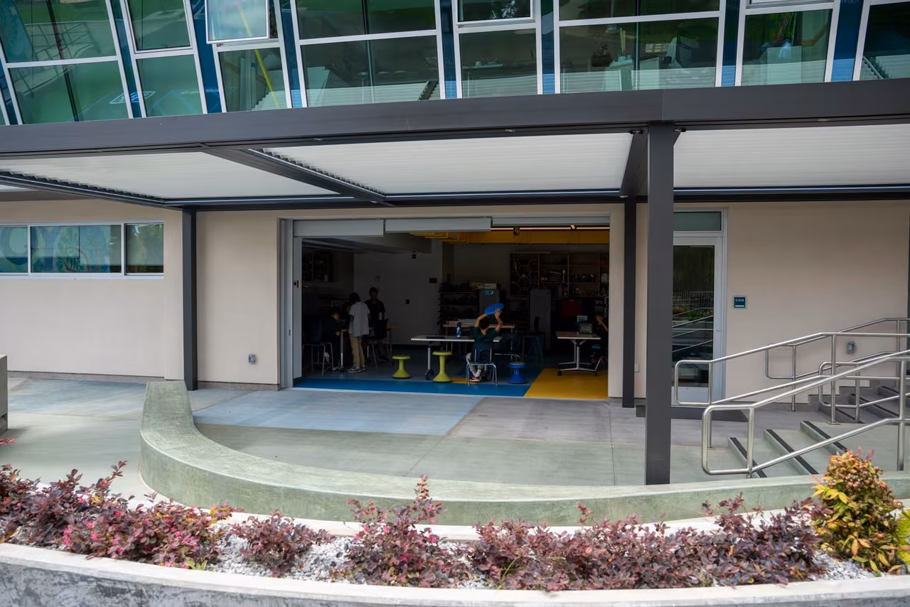 The Innovation Lab opens onto the covered patio and curved outdoor seating.