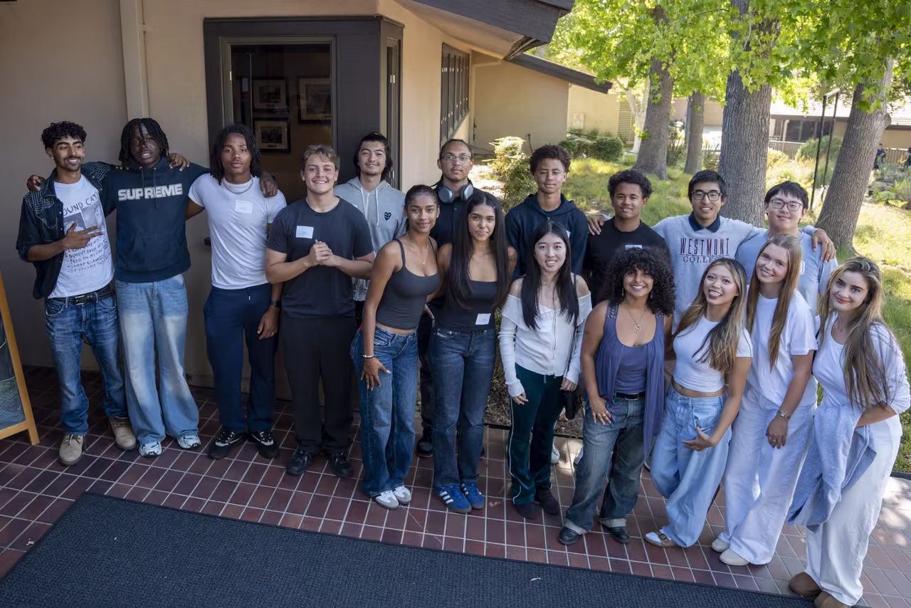 Alumni pose together outside the library at the Senior Send-Off.